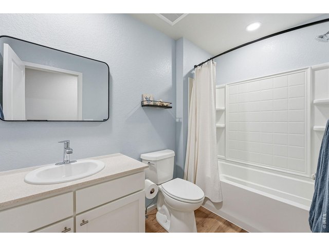 Property Photo 27 Two additional bedrooms feature walk-in closets and share a full bath