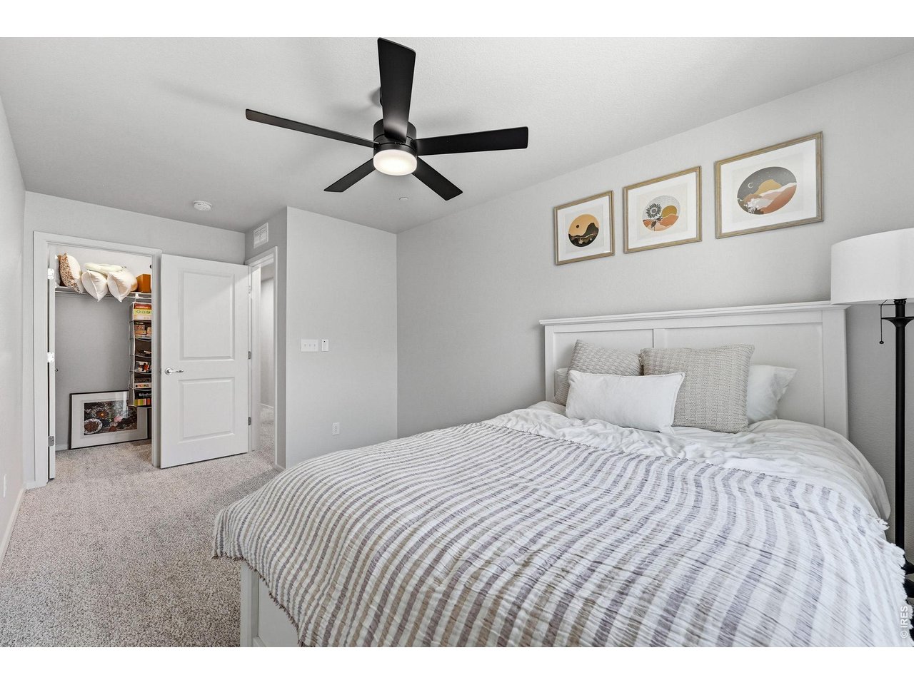 Two additional bedrooms feature walk-in closets and share a full bath
