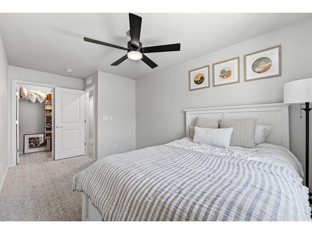 Property Photo 25 Two additional bedrooms feature walk-in closets and share a full bath