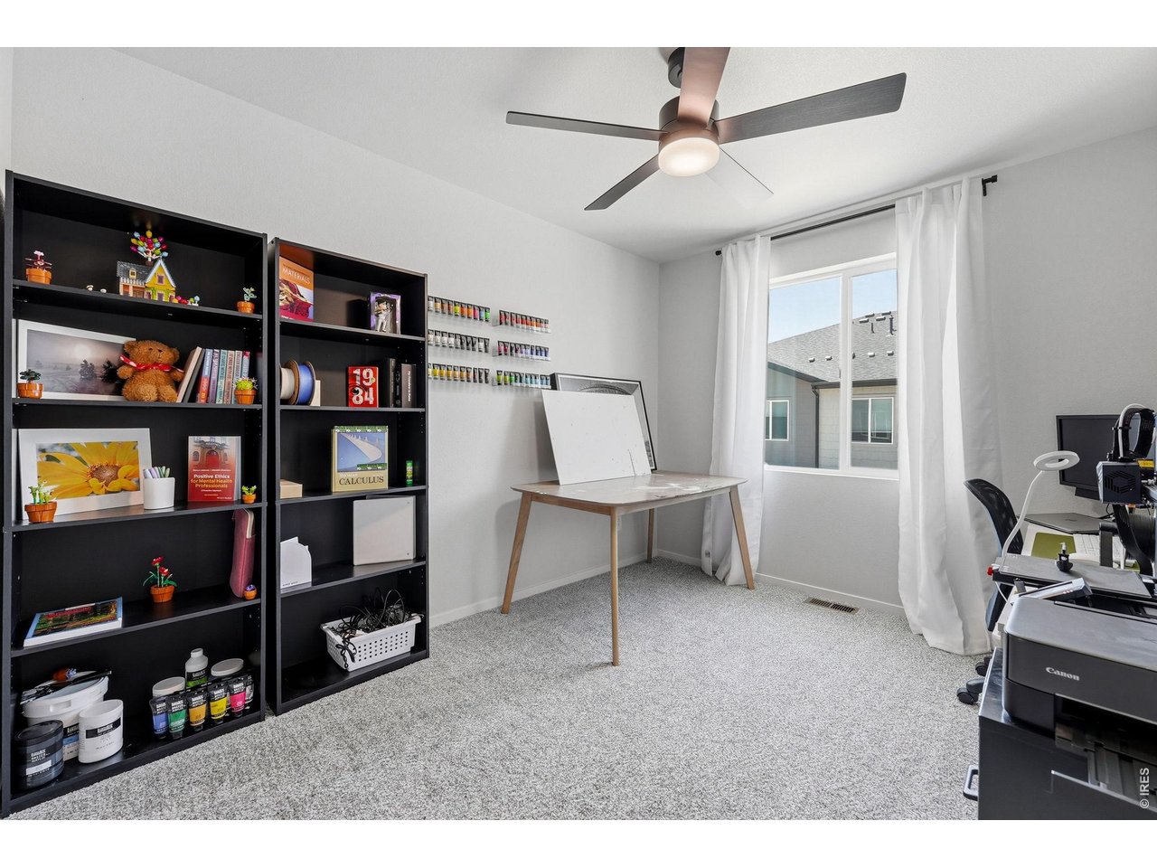 Two additional bedrooms feature walk-in closets and share a full bath