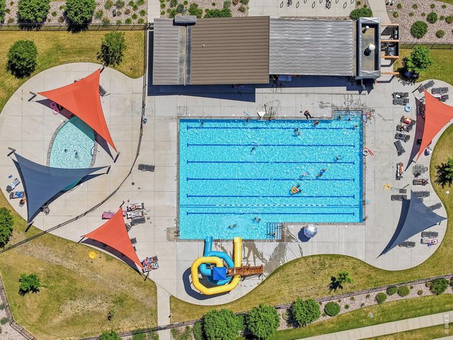 Property Photo 34 Enjoy resort style amenities including two pools, a hot tub, playgrounds, trails, community BBQ areas, abundant green space, and a 20 acre park