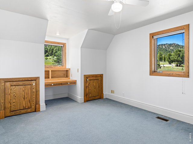 Property Photo 29 Bedroom 2 of 3, with built-in desk