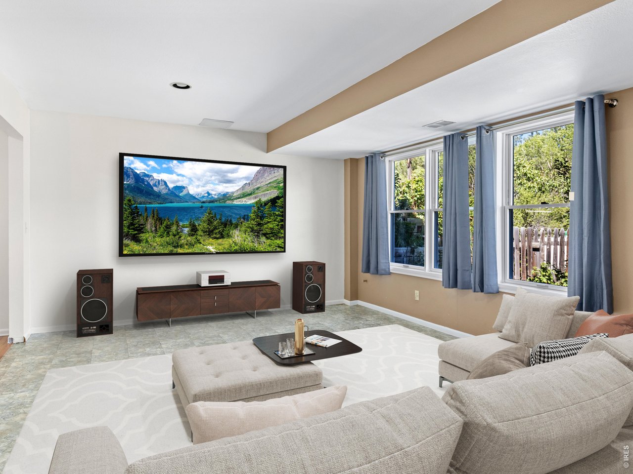 Property Photo 34 Lower level theatre room, digitally staged