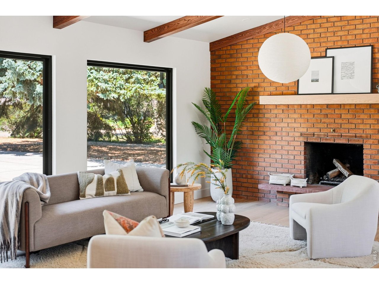 Property Photo 18 Original brick fireplace celebrates the home's enduring mid-century heritage