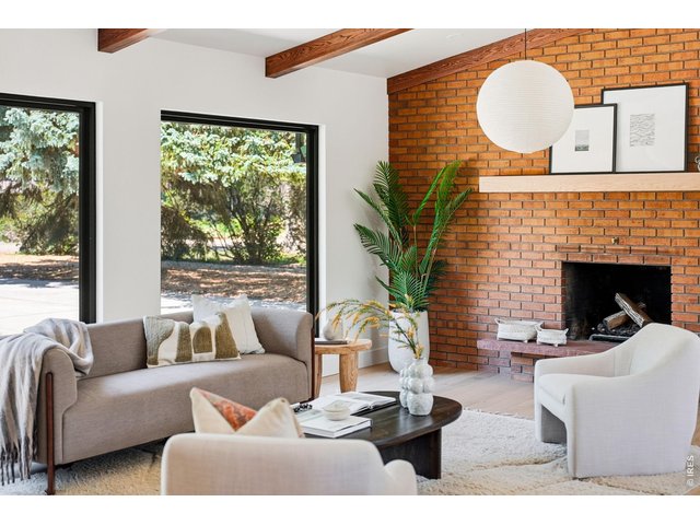 Property Photo 18 Original brick fireplace celebrates the home's enduring mid-century heritage