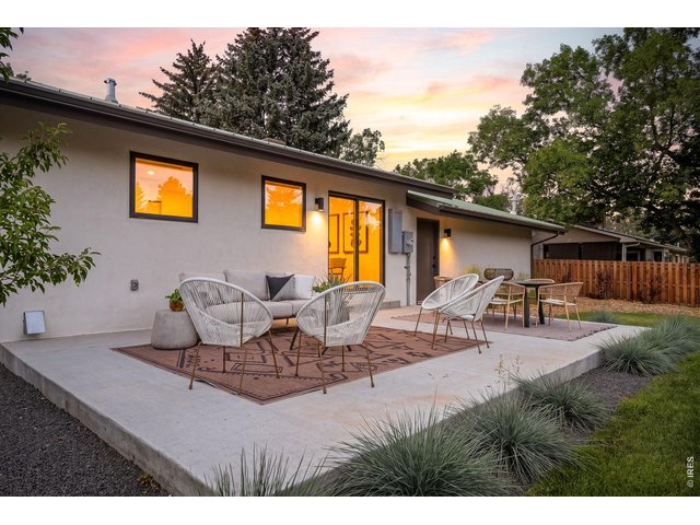 Property Photo 38 Large patio extends the living space outdoors, with ample room for lounging & dining