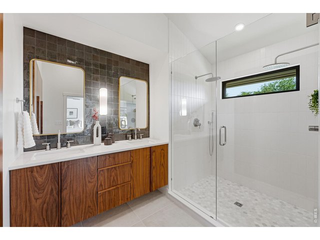 Property Photo 27 Oversized walk-in shower with a dual-head shower system for a luxurious retreat-like experience