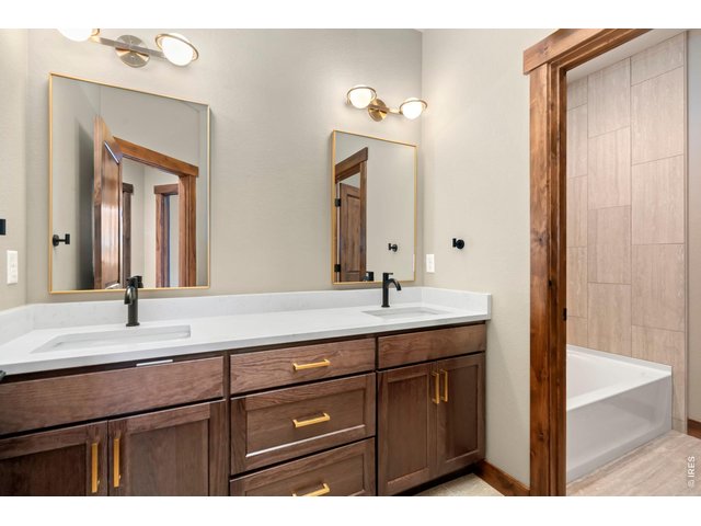 Property Photo 22 Full guest bathroom with double sinks