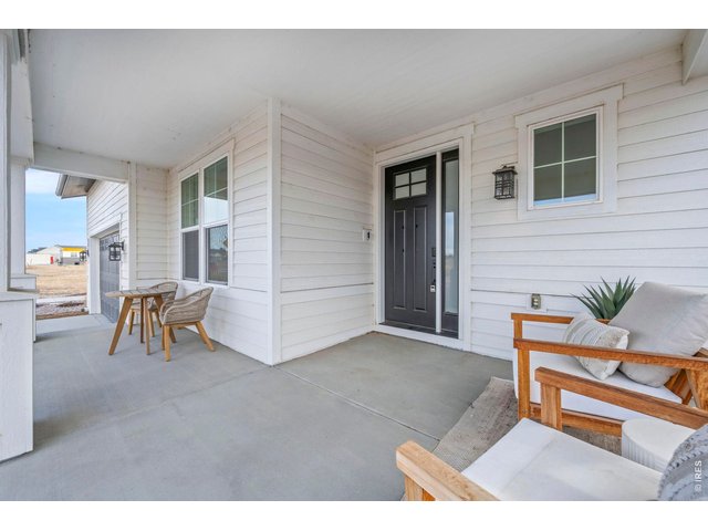 Property Photo 5 Front porch furniture not included