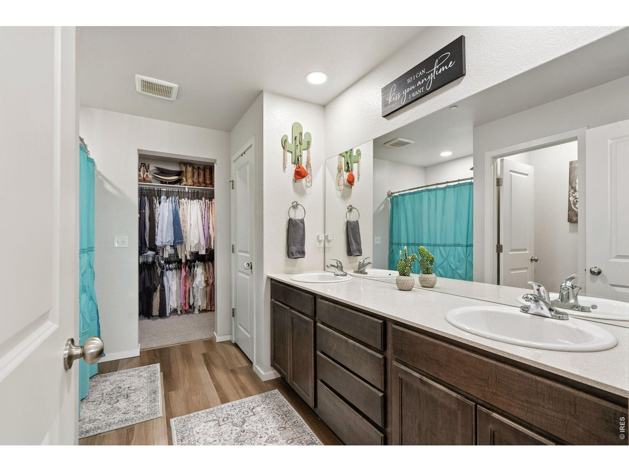 Property Photo 22 Primary Bath with Dual Sinks and walk-in shower and walk-in Closet