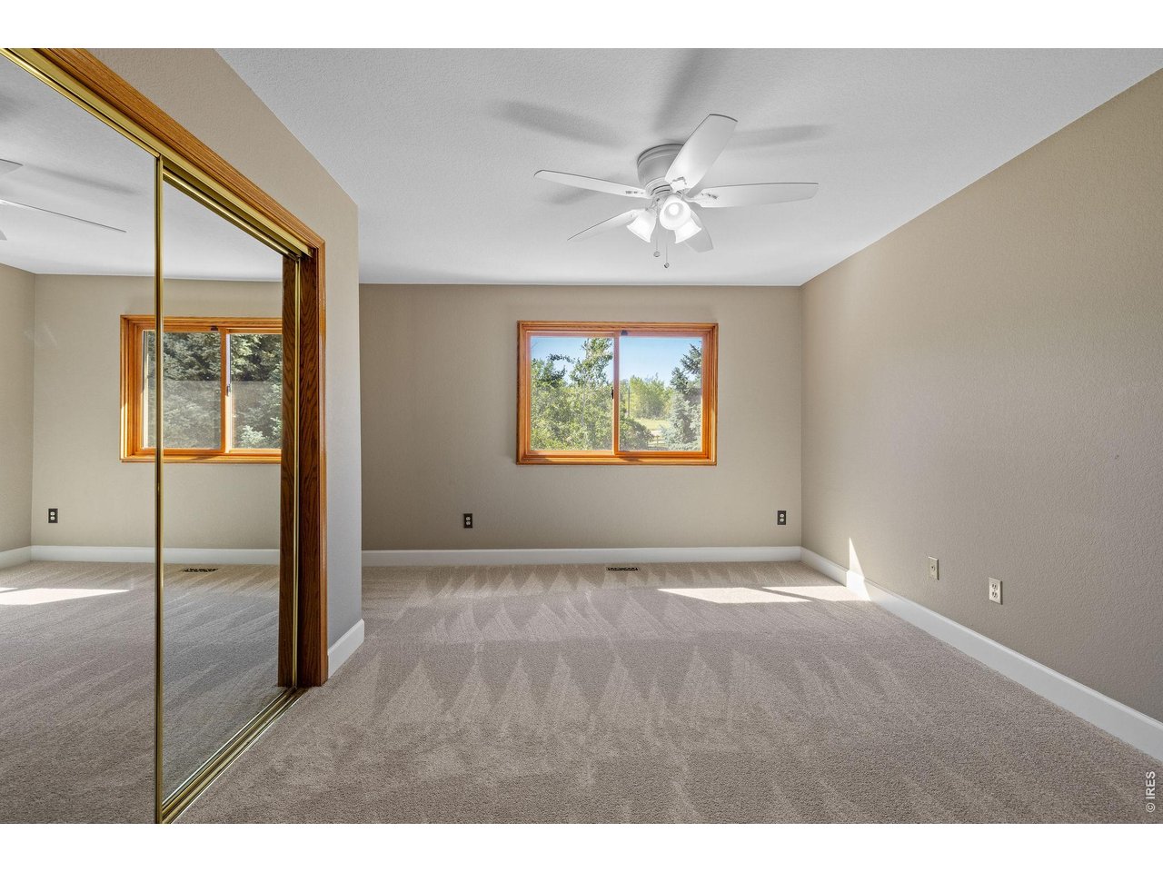 Sunlit, main level bedroom situated next to the convenient 3/4 bath