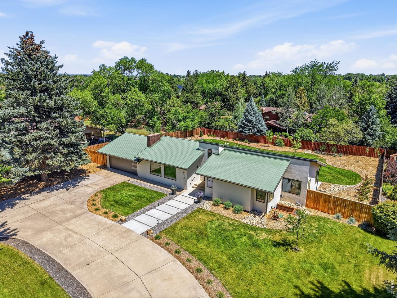 Property Photo 4 24 gauge standing seam metal roof, new stucco, all new landscaping & irrigation & new Anderson composite windows!