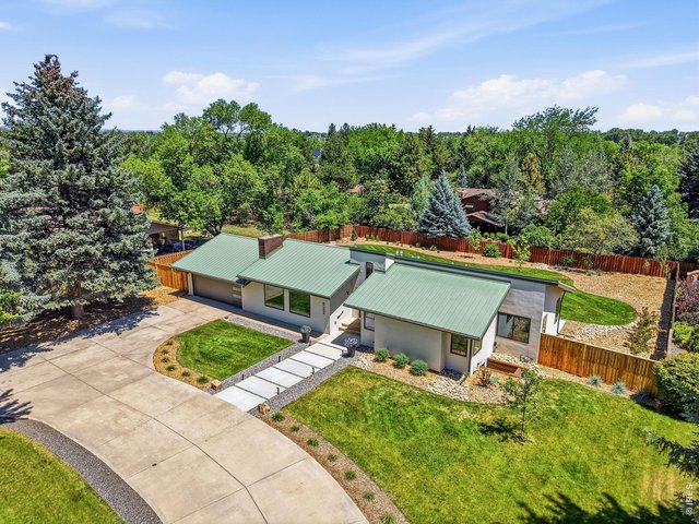 Property Photo 4 24 gauge standing seam metal roof, new stucco, all new landscaping & irrigation & new Anderson composite windows!