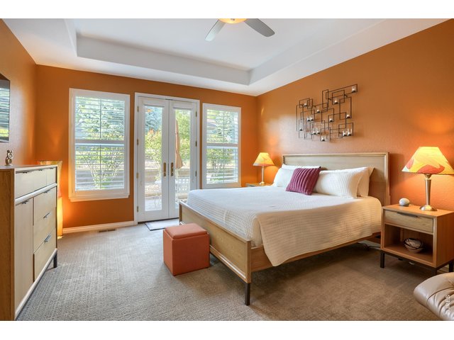 Property Photo 11 Primary bedroom with Fletcher doors for patio