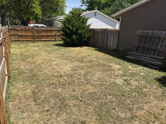 Property Photo 33 Second large yard space with privacy fence on the north side of the house.