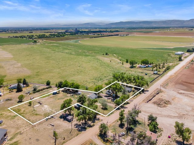 Property Photo 1 Live the homestead dream ~ 2.3 acres w/ THREE OUTBUILDINGS and OPEN zoning. Lot lines are approximate & should be verified.