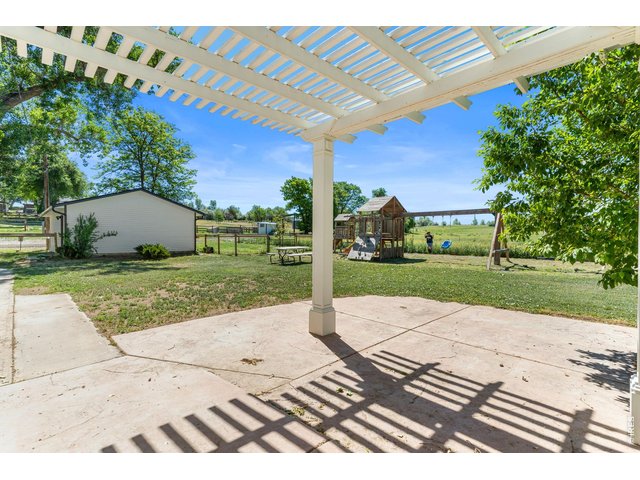 Property Photo 8 Pergola covered porch