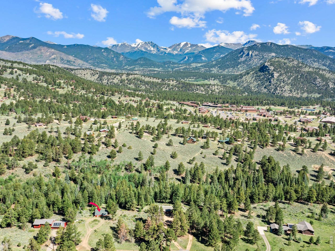 Perfectly situated on over two private acres with mature trees and bordering a seasonal stream and the YMCA