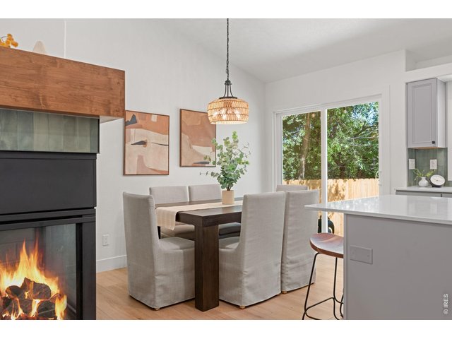Property Photo 11 Dual-sided gas fireplace in the living and dining spaces