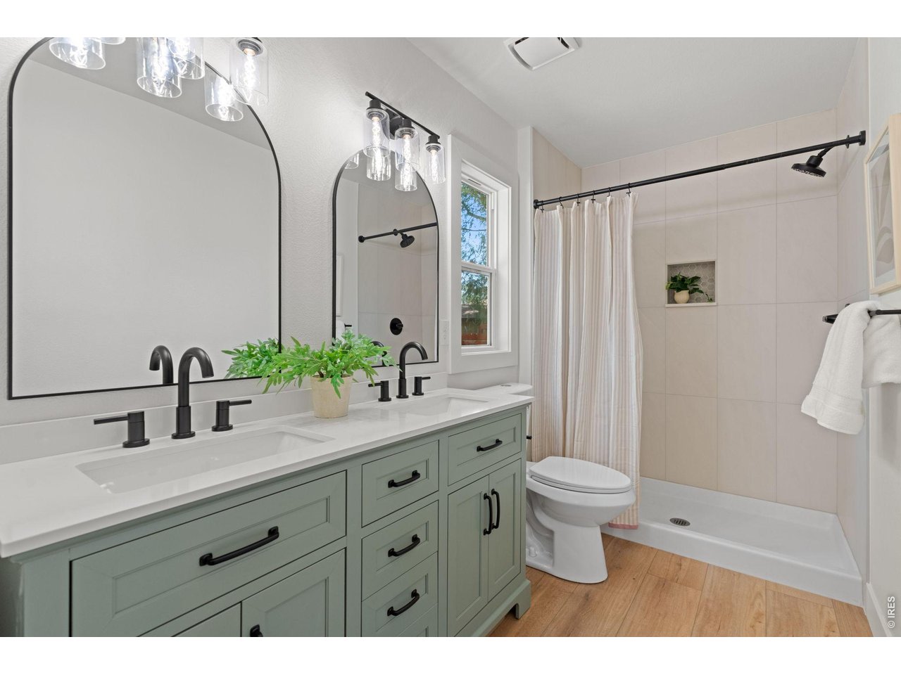 Property Photo 23 Beautifully remodeled primary bathroom featuring a custom tile shower surround