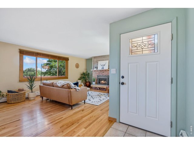Property Photo 4 Bright living room with new hardwood floors!