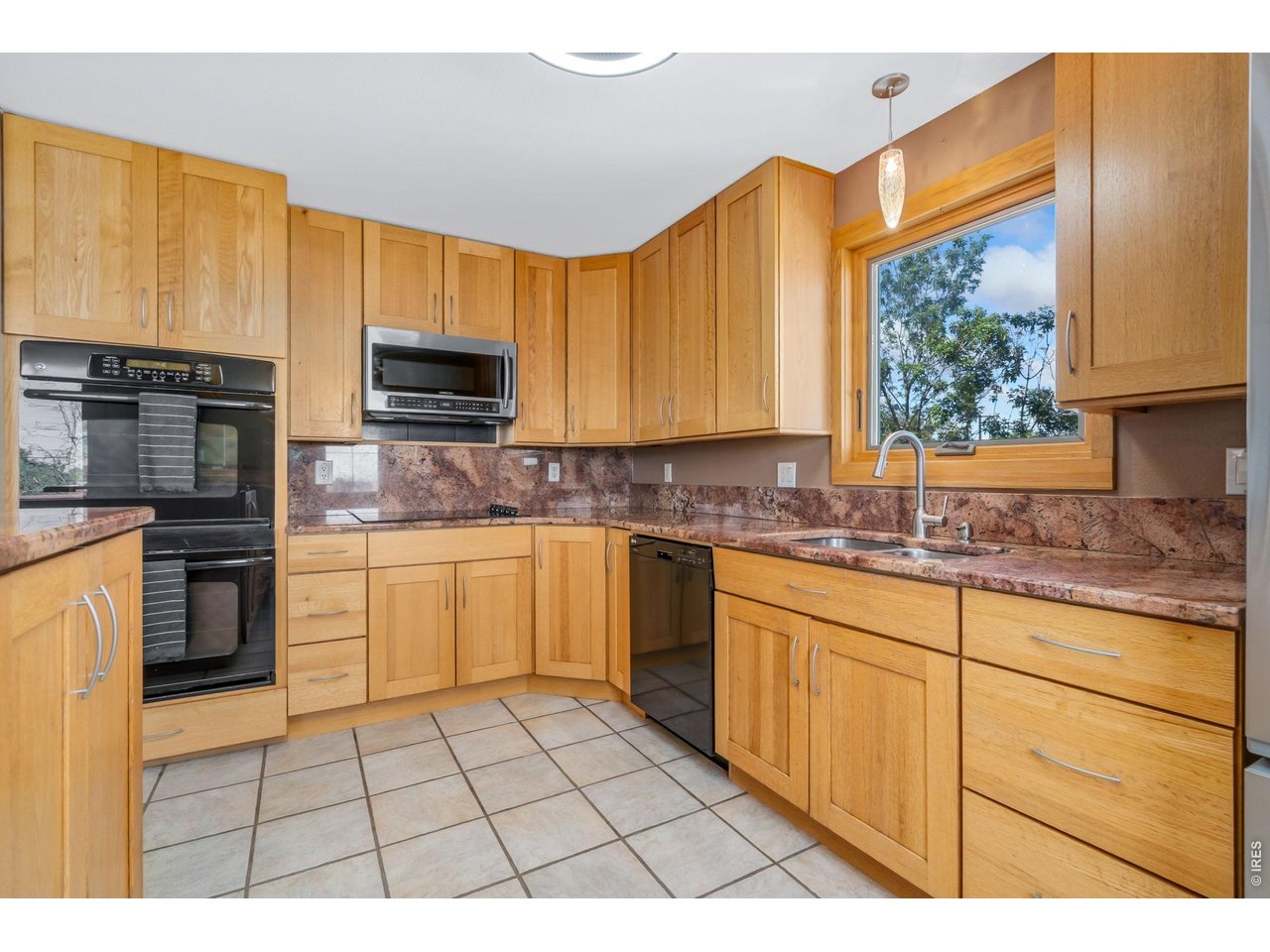 Double ovens, large windows provide lots of light. 