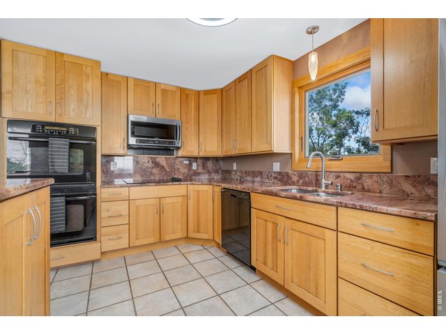 Property Photo 11 Double ovens, large windows provide lots of light. 