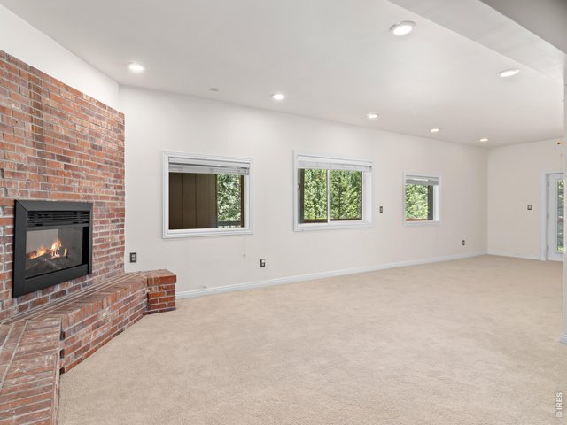 Property Photo 34 Lower Level Rec Room with Electric Fireplace