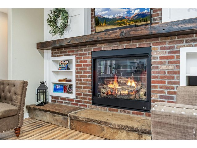 Property Photo 19 Grab your coffee and a book to snuggle up at the fireplace nook. This brand-new gas fireplace insert offers beauty, exceptional heating and long-term durability.