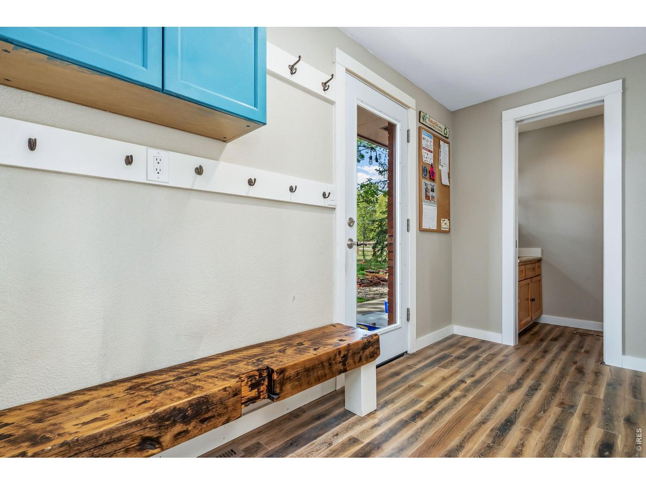 Backpack drop station, backyard door and tucked-away powder bath