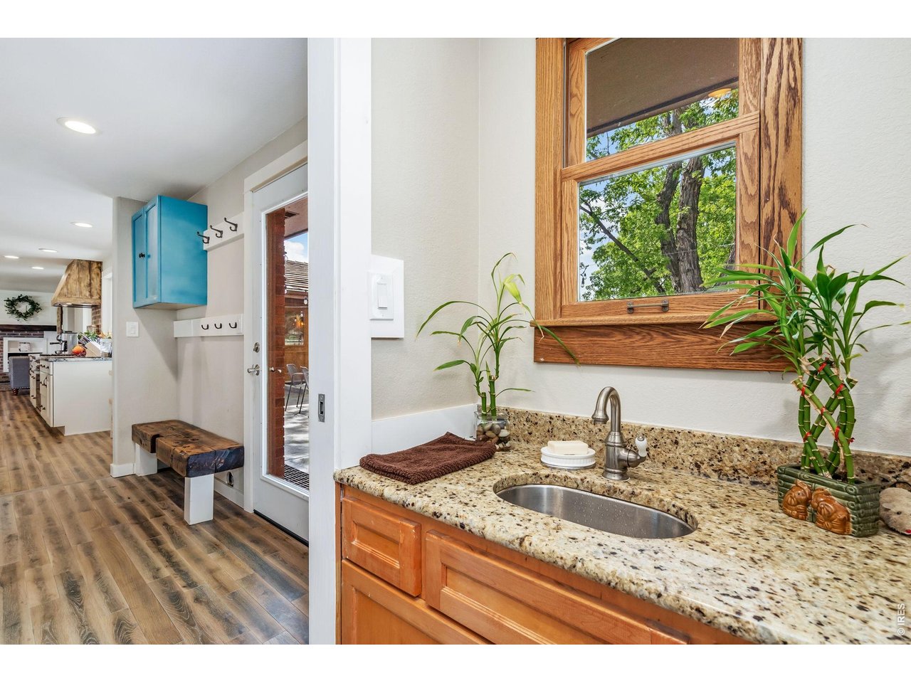 Extending from the kitchen, you will find a convenient drop station, a powder room, door to backyard and staircase leading to the basement.