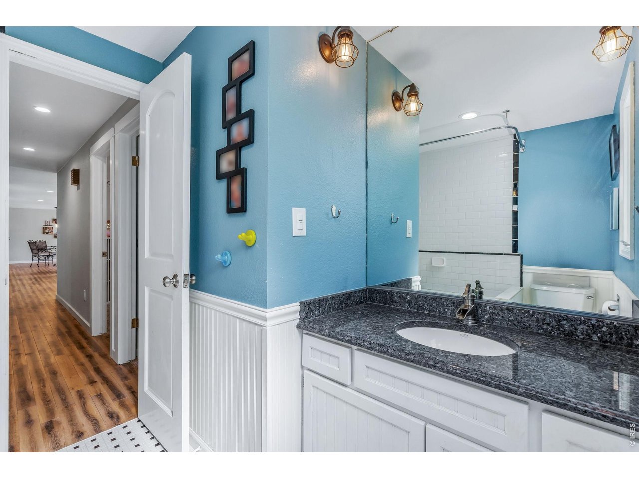 Spacious second bathroom situated between bedrooms 2 and 3, featuring a deep soaking tub and shower.