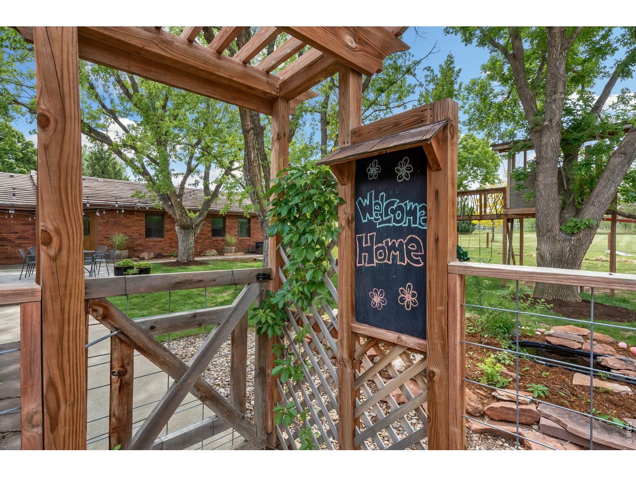 Fenced access to backyard from the driveway- Welcome Home!