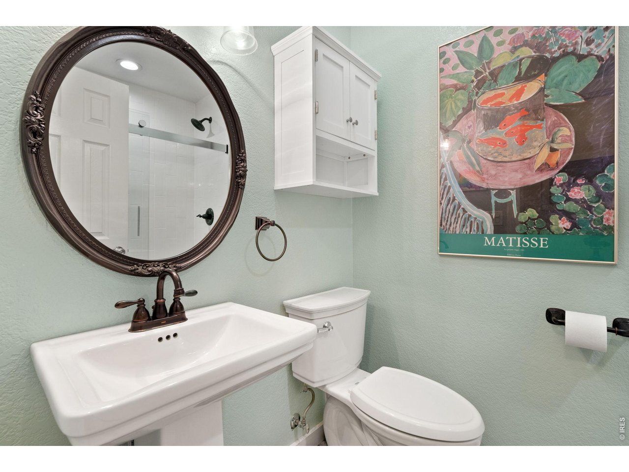 Bathroom featuring a shower, conveniently located in a separate hallway adjacent to Bedroom 2-an ideal layout for multi-generational living or guests.
