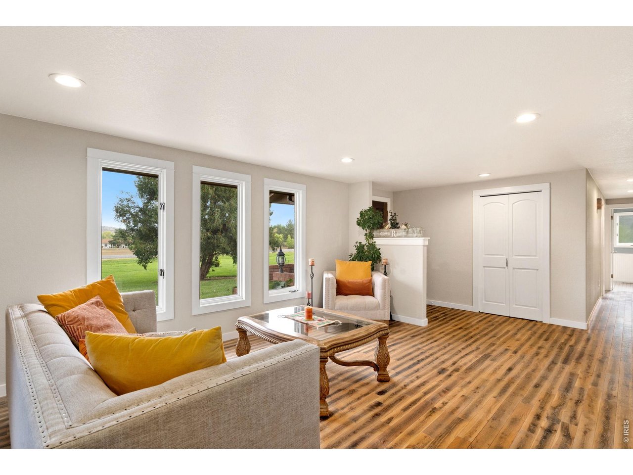 Enter into this bright and inviting living room - featuring an open-concept layout that seamlessly connects to the surrounding living spaces