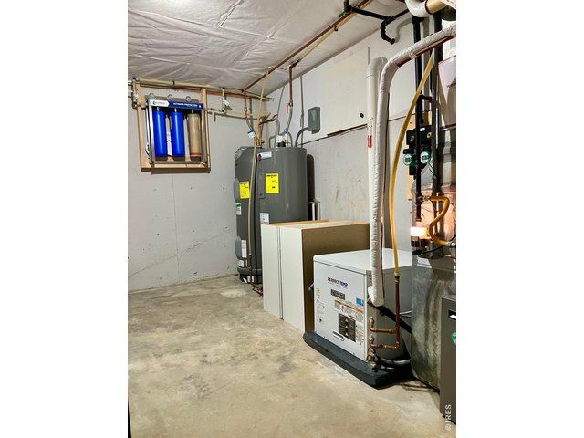Property Photo 50 Geothermal heating & cooling system with one Geothermal Water Heater and a second Electrical Finishing Water Heater 