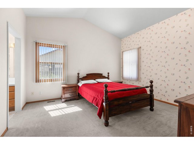Property Photo 10 Primary bedroom with ensuite bathroom.