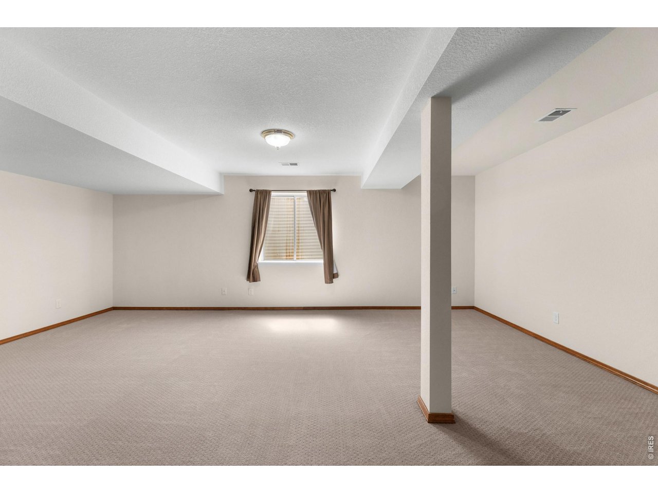 Large open family room in basement.