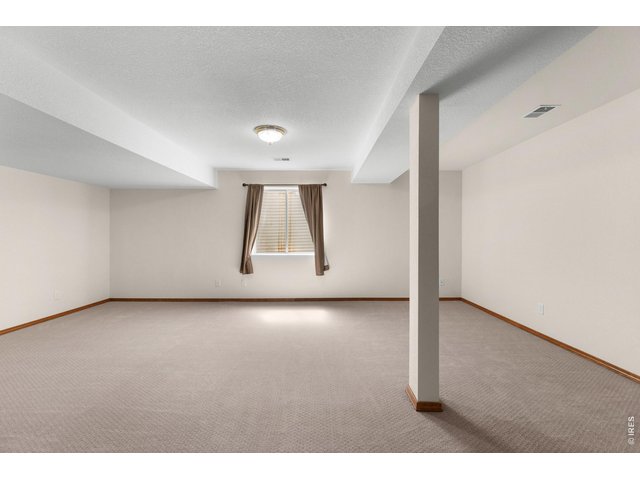 Property Photo 20 Large open family room in basement.