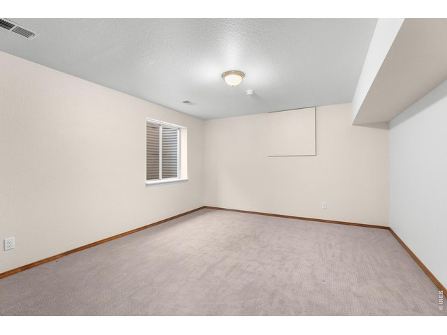 Property Photo 17 Bedroom #3 in basement.