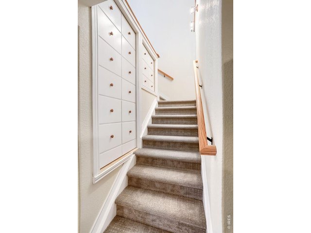 Property Photo 20 Stairway to basement with built-in storage behind those doors