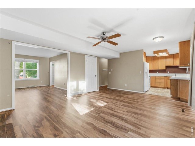 Property Photo 9 Kitchen flows into the Family Room that looks into the Living Room