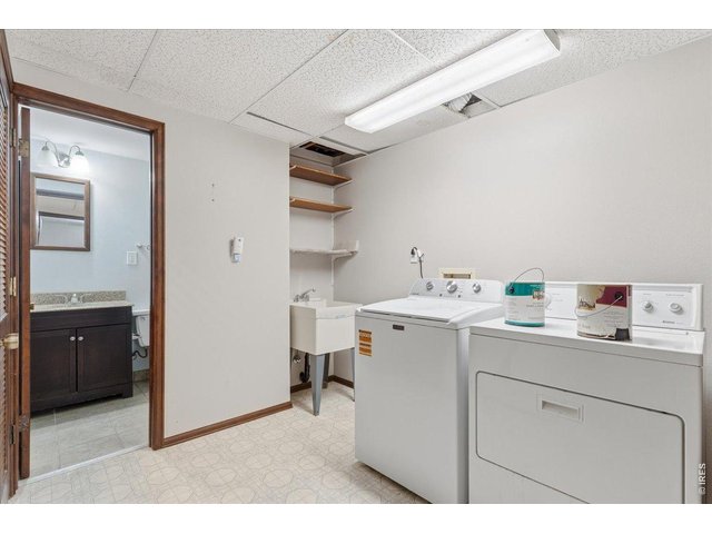 Property Photo 28 Laundry Room with scrub sink and storage