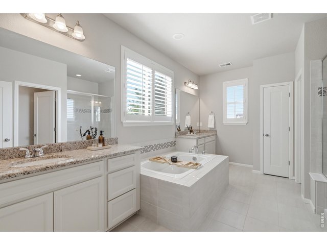 Property Photo 18 Large 5-piece bath with separate vanities means everyone has their own space