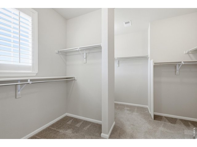 Property Photo 20 The walk-in closet has a nice division for two individual's separate belongings