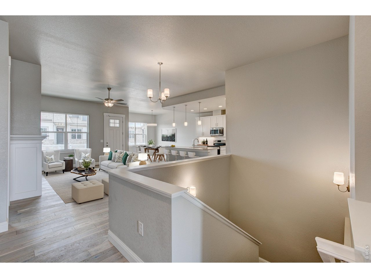 Property Photo 16 Stairs to the full, finished basement providing rec room, living room & 2 additional bedrooms! 