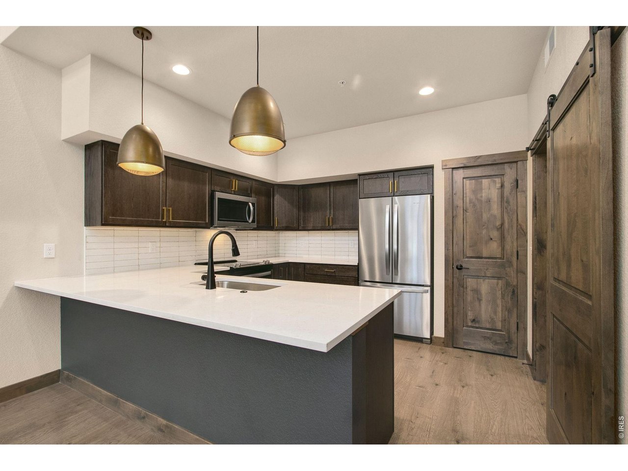 Property Photo 4 Quartz countertops and stainless appliances