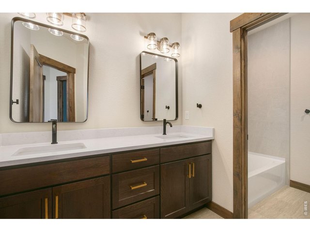 Property Photo 22 Upstairs guest bathroom with tub