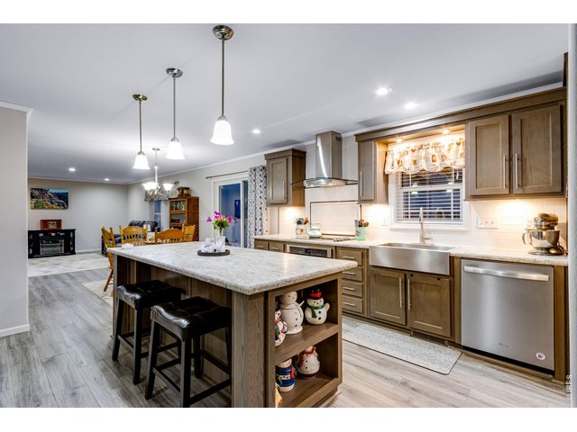 Property Photo 17 Spacious kitchen features a center island with breakfast bar