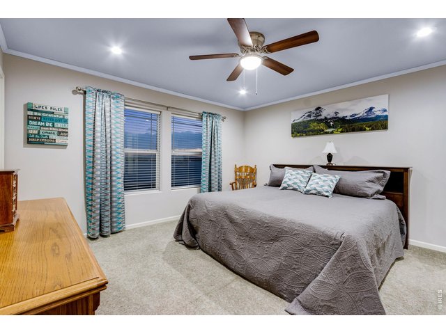 Property Photo 24 Primary bedroom with retreat features incredible views, ceiling fan, walk-in closet